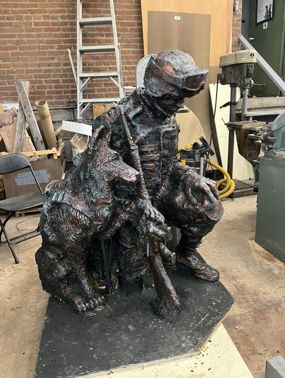 brass sculpture of veteran and dog Honoring History Through Sculpture: The Work of Stephen Colley